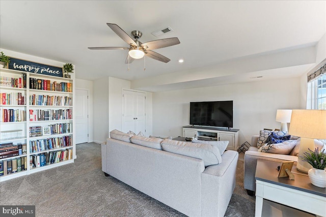 living room with carpet flooring and ceiling fan