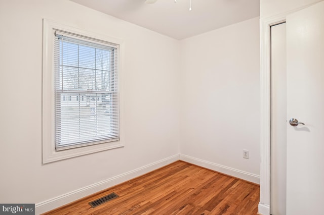 unfurnished room featuring hardwood / wood-style flooring and ceiling fan