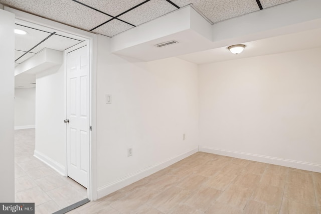 basement featuring a drop ceiling