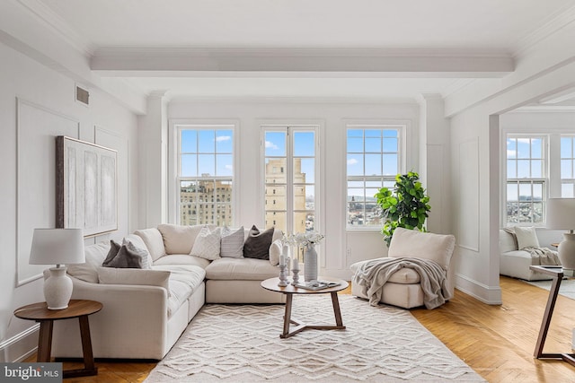 living room featuring light parquet flooring, a healthy amount of sunlight, and crown molding