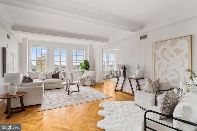 living room featuring light parquet flooring, ornamental molding, and beamed ceiling