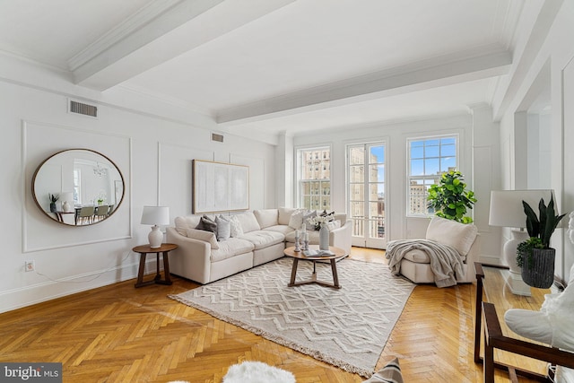 living room featuring light parquet floors, crown molding, and beamed ceiling