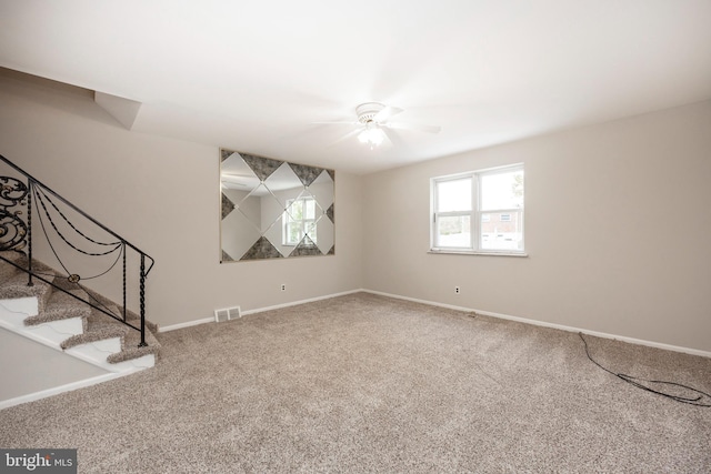 carpeted empty room with ceiling fan