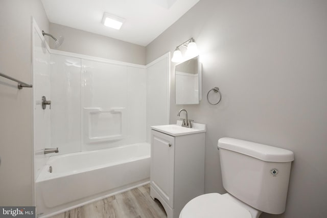 full bathroom featuring toilet, shower / tub combination, vanity, and hardwood / wood-style floors