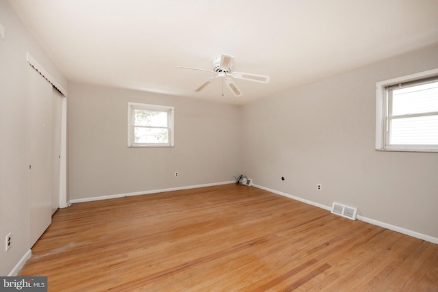 unfurnished bedroom featuring ceiling fan and light wood-type flooring