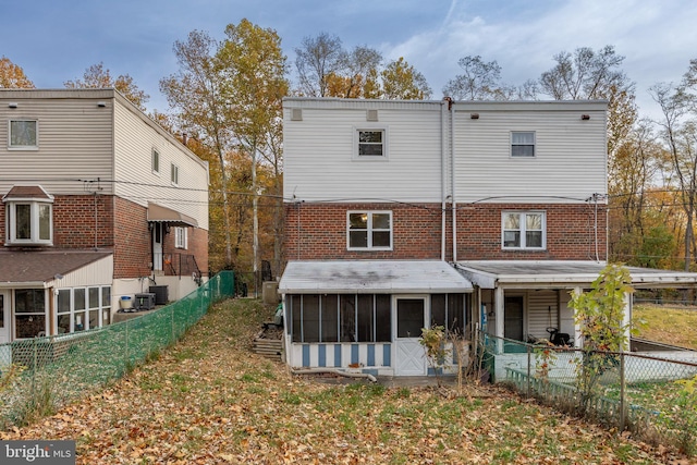 rear view of house with a sunroom