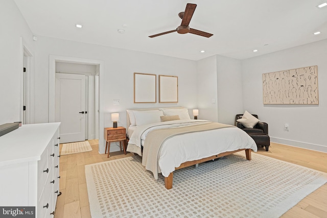 bedroom with light wood-type flooring and ceiling fan