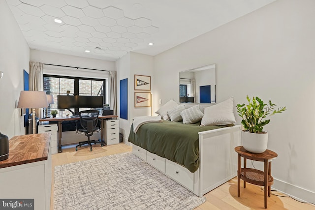 bedroom featuring light wood-type flooring