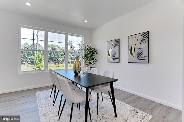 dining area with light hardwood / wood-style floors