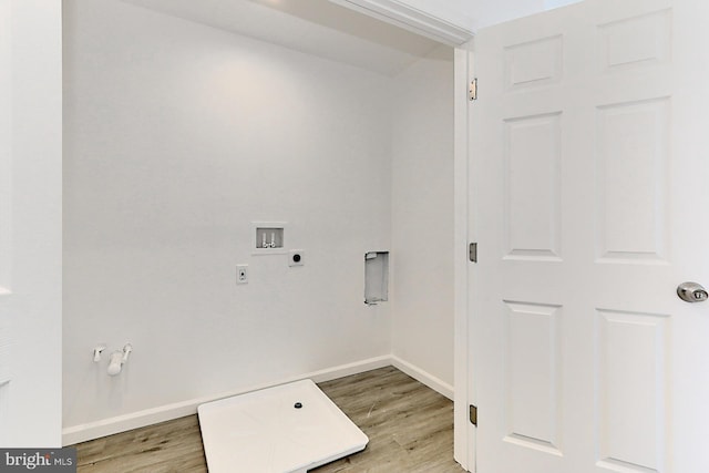 clothes washing area with washer hookup, wood-type flooring, and electric dryer hookup