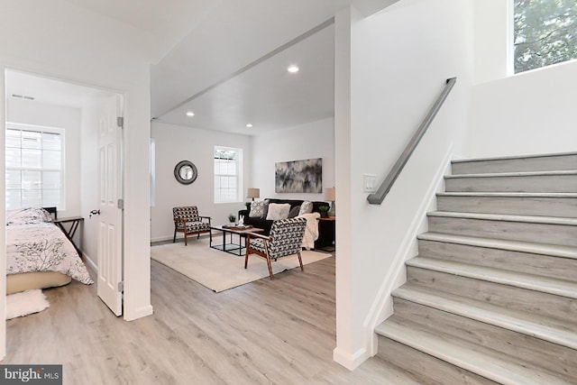 staircase featuring wood-type flooring