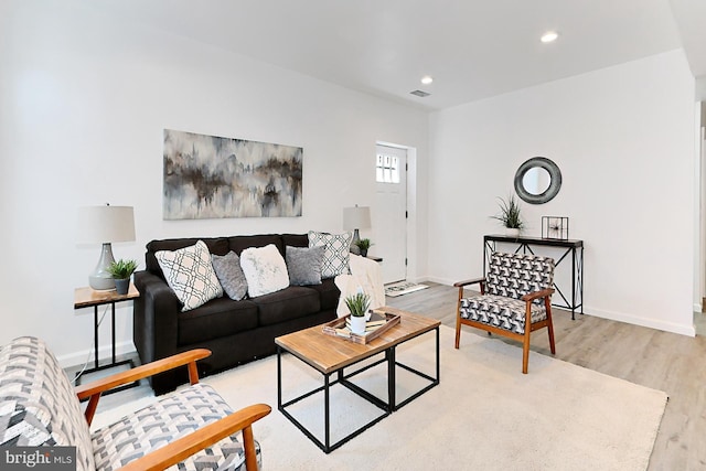 living room with light hardwood / wood-style floors