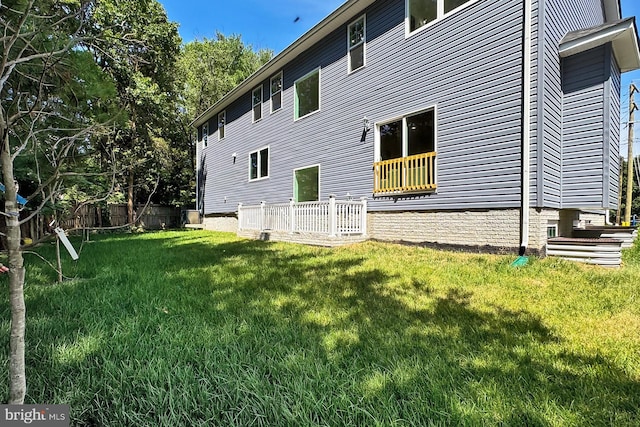 view of property exterior with a lawn