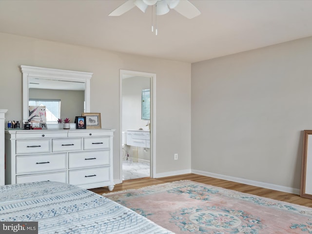 bedroom with ensuite bathroom, ceiling fan, and light hardwood / wood-style flooring