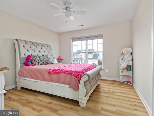 bedroom featuring light hardwood / wood-style flooring and ceiling fan