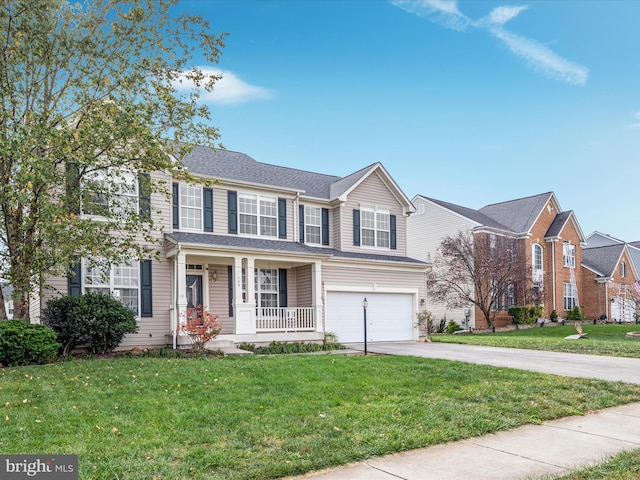 view of front of property featuring a garage, a porch, and a front yard