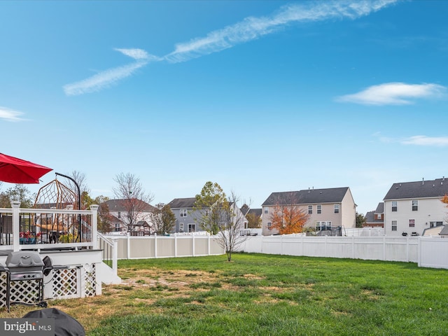 view of yard with a wooden deck