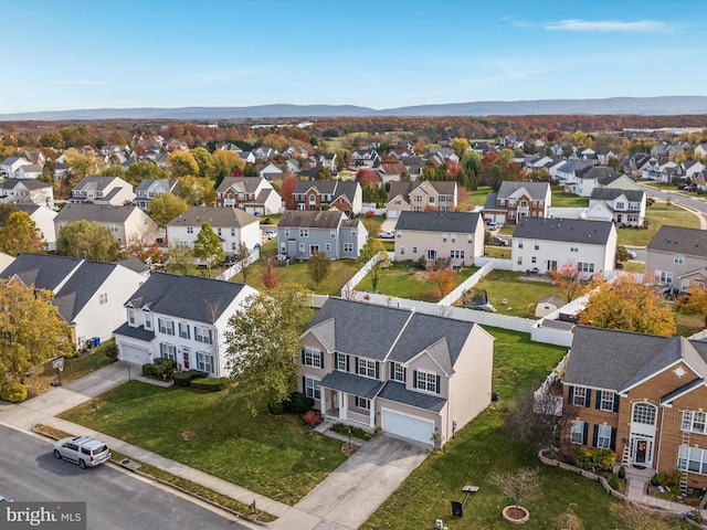 birds eye view of property featuring a mountain view