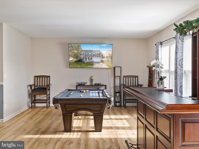 recreation room with pool table and light hardwood / wood-style flooring