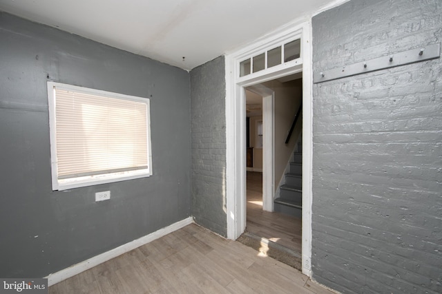 empty room featuring wood-type flooring