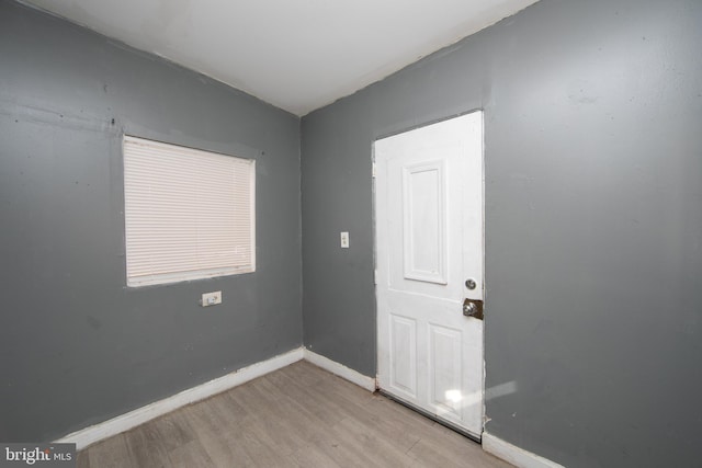 empty room with light hardwood / wood-style floors