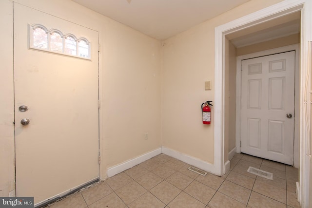 view of tiled foyer entrance