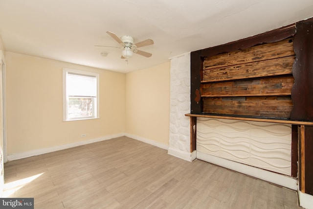 unfurnished living room with light hardwood / wood-style floors and ceiling fan