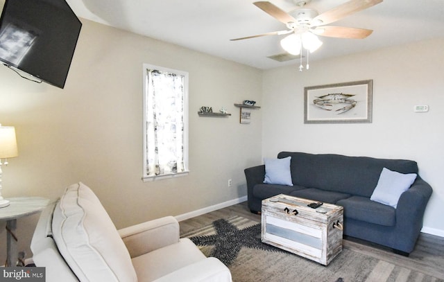 living room with hardwood / wood-style flooring and ceiling fan