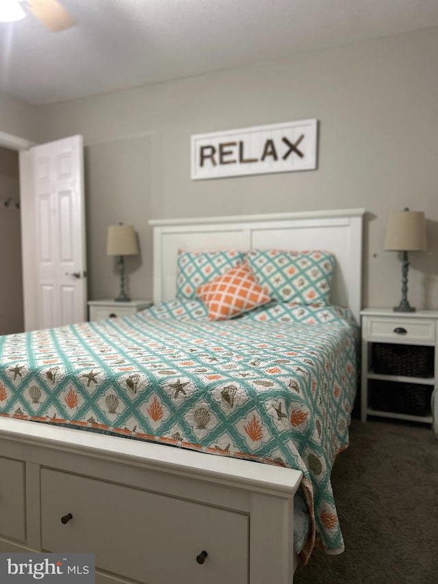 carpeted bedroom featuring ceiling fan