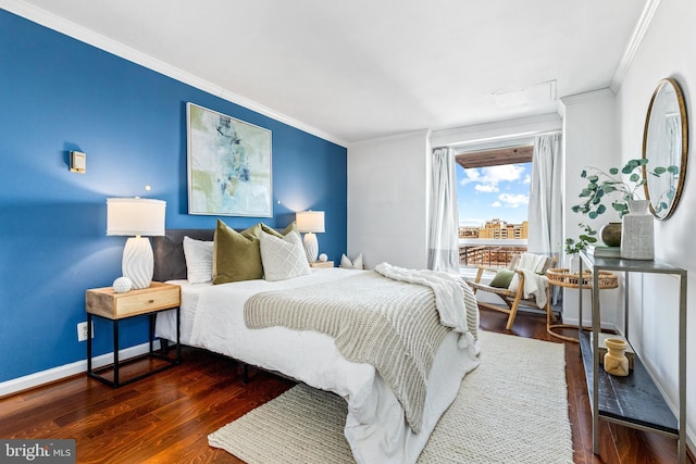 bedroom with ornamental molding and dark hardwood / wood-style flooring