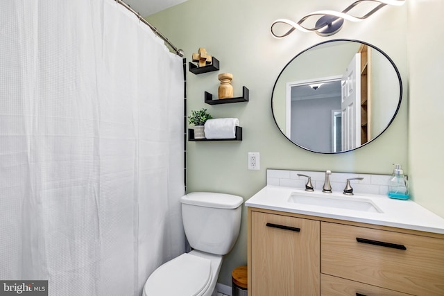 bathroom with toilet and vanity