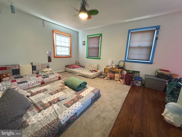 bedroom featuring dark hardwood / wood-style flooring and ceiling fan