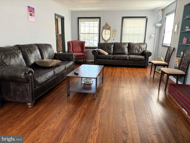 living room with dark wood-type flooring