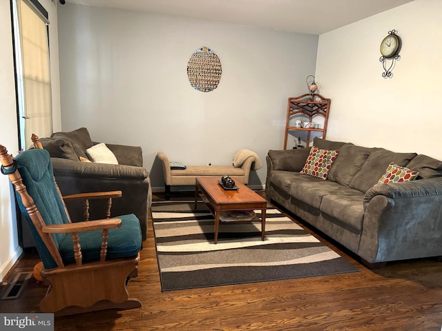 living room with dark hardwood / wood-style flooring