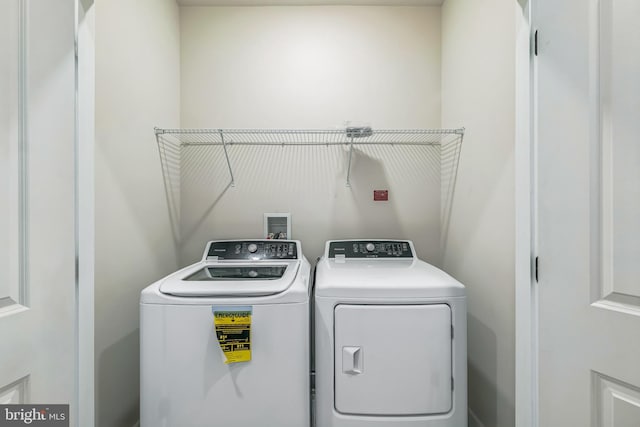 laundry room featuring independent washer and dryer