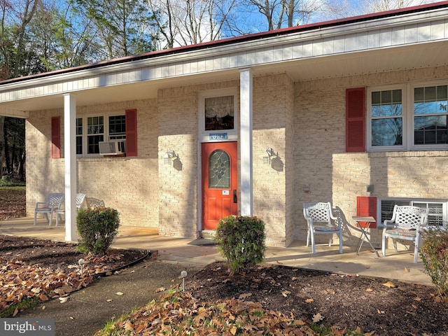 doorway to property featuring cooling unit