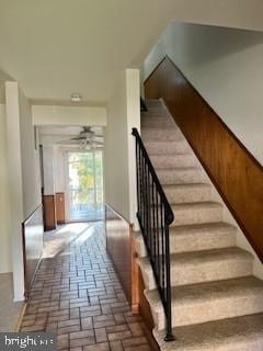 stairway with ceiling fan