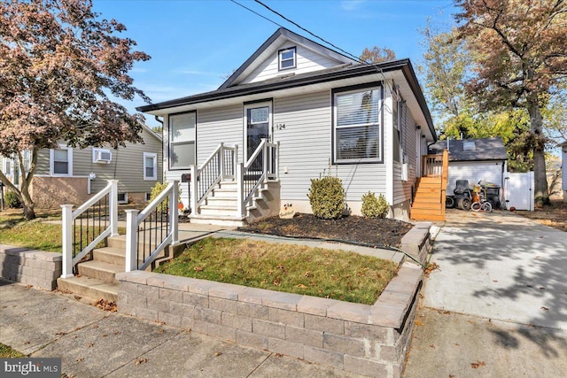 view of front of property with a wall mounted AC