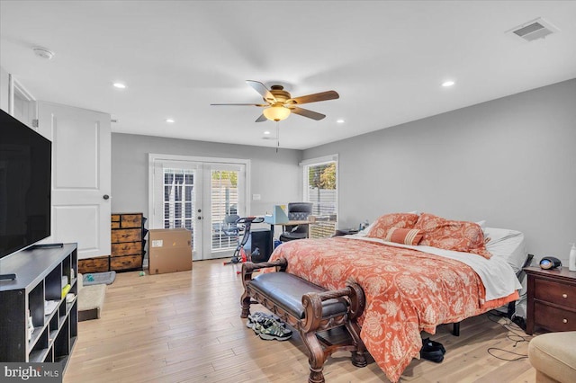 bedroom with light hardwood / wood-style floors, french doors, ceiling fan, and access to exterior