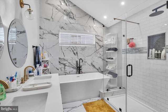 full bathroom with a stall shower, marble finish floors, a freestanding tub, recessed lighting, and double vanity