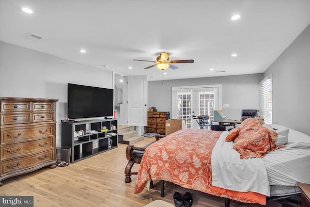 bedroom with french doors, light hardwood / wood-style flooring, and ceiling fan