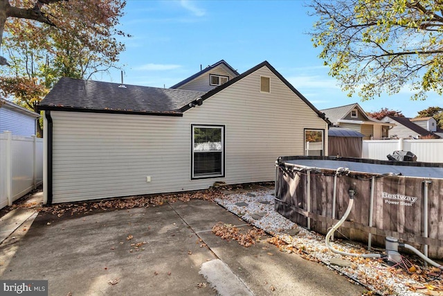 back of property with a patio