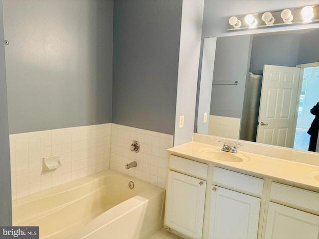 bathroom with a bathtub and vanity