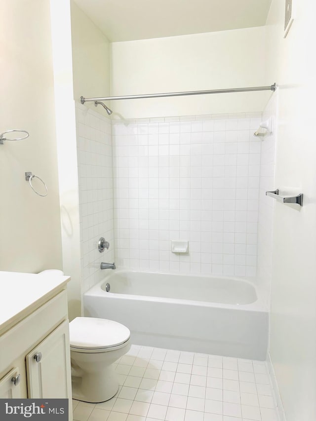 full bathroom featuring tile patterned flooring, vanity, toilet, and tiled shower / bath combo