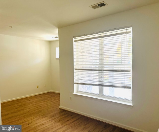 unfurnished room featuring hardwood / wood-style floors