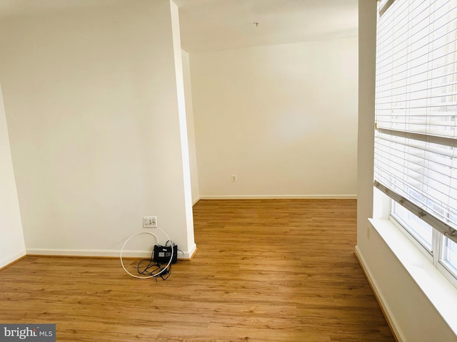 empty room with light hardwood / wood-style flooring