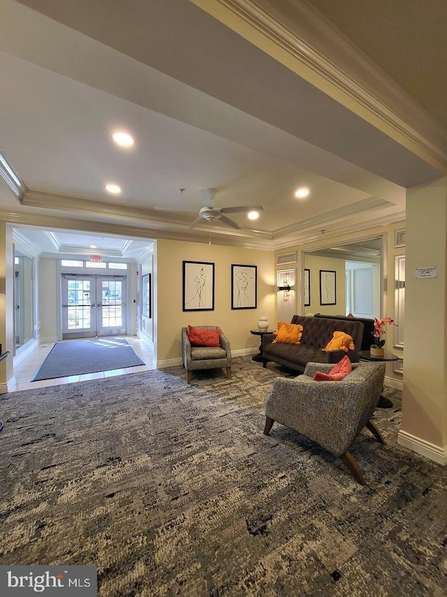 interior space featuring ceiling fan, french doors, carpet, and ornamental molding