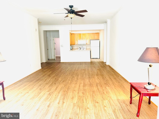 unfurnished living room featuring light hardwood / wood-style floors, ceiling fan, and crown molding