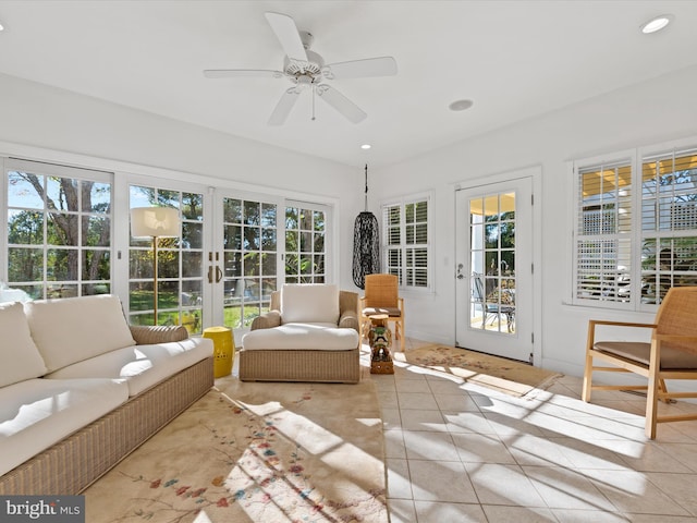 sunroom with ceiling fan and a healthy amount of sunlight