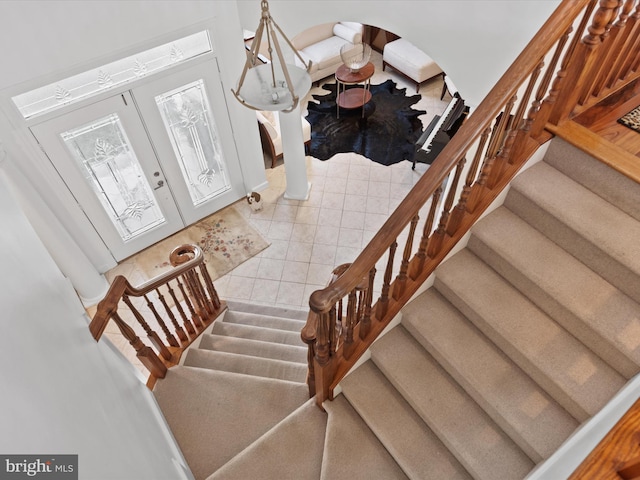 9 Glade Farm Dr, Rehoboth Beach, DE 19971 - staircase featuring arched walkways and tile patterned floors
